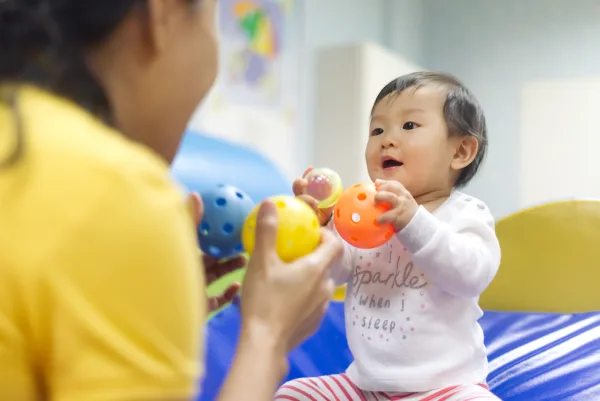 Baby Playing with Educator Free Available Resources in Indiana